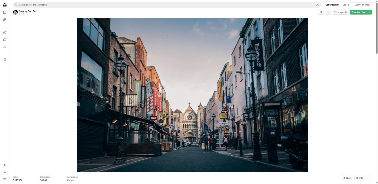 Dublin city street with shops and a church in the background